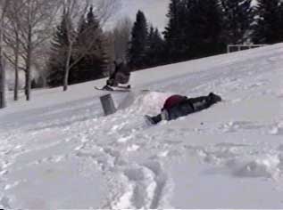 John riding a GT Snow Racer off a jump