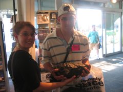 Kevin and Kristin holding a rock worth $10,000