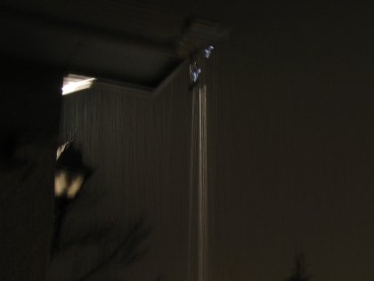 Water pouring out the corner of the eavestrough