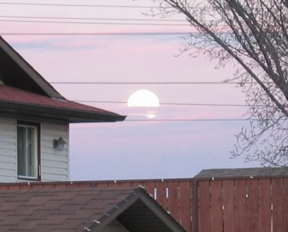 Moon over a wire