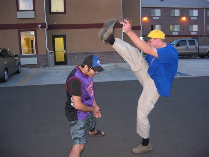 Blair high-kicking over Mark's head