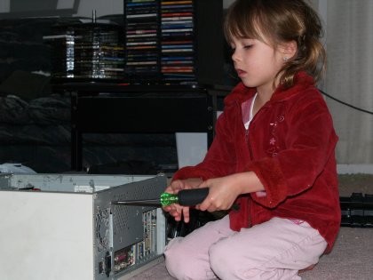 Maddy removing the faulty power supply from my computer
