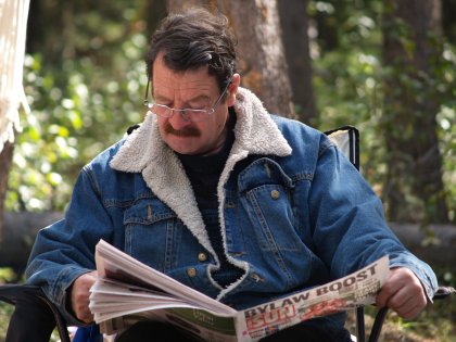 Dad reading the paper by the fire