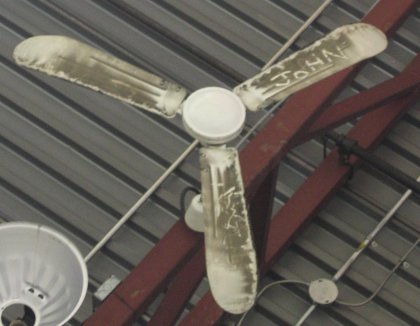 Some clown thought it would be funny to write his name in the dust on the ceiling fan