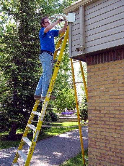 Kevin *looks* like he's working, but he's actually only pretending to mount that camera.