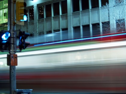 The LRT blazes by an empty downtown street