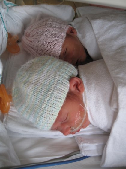 Twins travelling inside a portable incubator