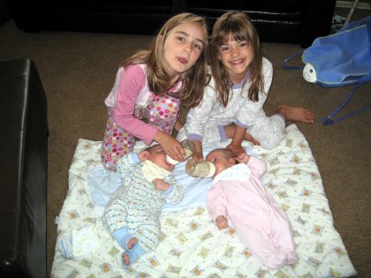 Big sisters feeding the babies