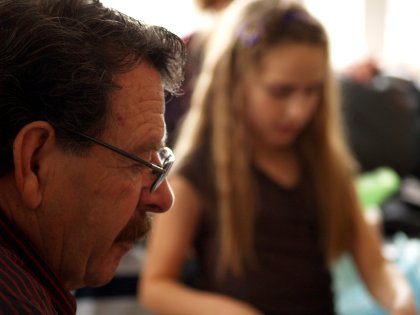 My dad looks on over the festivities